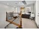 Upstairs office nook with wooden railing and a built-in desk at 220 Villa Borghese St, Las Vegas, NV 89138