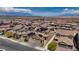 Neighborhood aerial view showing homes with solar panels and desert scenery at 242 Polaris Ridge Ave, Henderson, NV 89011