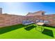 Artificial grass and patio set, offering a relaxing outdoor space at 242 Polaris Ridge Ave, Henderson, NV 89011