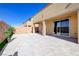 Expansive backyard with stone pavers, artificial turf, and outdoor living space at 242 Polaris Ridge Ave, Henderson, NV 89011