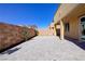 Backyard featuring stone pavers, desert landscaping and low maintenance design at 242 Polaris Ridge Ave, Henderson, NV 89011