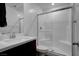 Bathroom featuring tile shower, tile flooring, and vanity with sink at 242 Polaris Ridge Ave, Henderson, NV 89011
