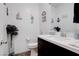 Charming half-bath featuring a marine theme, dark vanity and decorative nautical decor at 242 Polaris Ridge Ave, Henderson, NV 89011