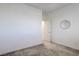 Carpeted bedroom featuring neutral walls, with a view into hallway and closet at 242 Polaris Ridge Ave, Henderson, NV 89011