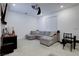 Comfortable bonus room featuring a large sectional sofa and media setup at 242 Polaris Ridge Ave, Henderson, NV 89011
