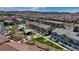 Aerial photo showing community amenities including green space, shade structures, and residential buildings at 242 Polaris Ridge Ave, Henderson, NV 89011