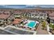 An aerial shot showcases a community pool, complete with a shaded lounging area and accessible parking at 242 Polaris Ridge Ave, Henderson, NV 89011