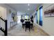 Bright dining area showcasing modern furnishings and decor, seamlessly connecting to other living spaces for open-concept living at 242 Polaris Ridge Ave, Henderson, NV 89011