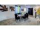 Inviting dining room with modern decor, stylish furniture, and contemporary artwork for elegant meals and entertaining guests at 242 Polaris Ridge Ave, Henderson, NV 89011