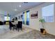 Spacious dining area with colorful accents, natural light, and modern furnishings at 242 Polaris Ridge Ave, Henderson, NV 89011