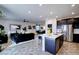 A well-designed kitchen with stainless steel appliances flows into a cozy living and dining area at 242 Polaris Ridge Ave, Henderson, NV 89011