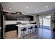 Kitchen boasts stainless steel appliances and a center island with bar stool seating at 242 Polaris Ridge Ave, Henderson, NV 89011