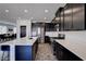 Close up of kitchen showing long island, stainless steel appliances, and tile flooring at 242 Polaris Ridge Ave, Henderson, NV 89011