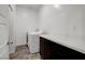 Functional laundry room features washer, dryer, countertop, and cabinets for storage at 242 Polaris Ridge Ave, Henderson, NV 89011