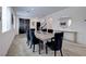 Stylish dining area featuring modern chairs, sleek decor, and a welcoming entryway at 242 Polaris Ridge Ave, Henderson, NV 89011