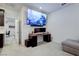 Relaxing living room with a gray sectional, desk, and media setup, offering comfort and functionality at 242 Polaris Ridge Ave, Henderson, NV 89011