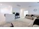 A well lit living room showcases a sectional couch with accent pillows and an entertainment center at 242 Polaris Ridge Ave, Henderson, NV 89011