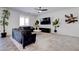 Cozy living room featuring stylish seating, sleek entertainment center, and an inviting atmosphere at 242 Polaris Ridge Ave, Henderson, NV 89011