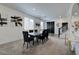 Modern dining area featuring contemporary decor, ample natural light, and inviting staircase at 242 Polaris Ridge Ave, Henderson, NV 89011