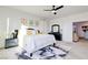 Cozy primary bedroom with a ceiling fan, side tables, and an en suite bathroom at 242 Polaris Ridge Ave, Henderson, NV 89011
