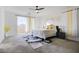 Inviting primary bedroom with mountain views, neutral tones, modern decor, and a ceiling fan at 242 Polaris Ridge Ave, Henderson, NV 89011