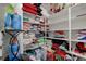 Well-organized storage room with shelves filled with linens and various household items at 242 Polaris Ridge Ave, Henderson, NV 89011