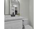 Updated bathroom featuring white vanity with quartz countertop and stylish mirror at 2461 Old Forge Ln # 103, Las Vegas, NV 89121