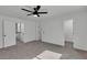 Neutral bedroom featuring carpet flooring, a ceiling fan, and two doors at 2461 Old Forge Ln # 103, Las Vegas, NV 89121
