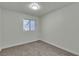 Bedroom features neutral paint, carpet, and one window at 2461 Old Forge Ln # 103, Las Vegas, NV 89121