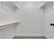 Walk-in closet features a clothing rod and a white shelf for extra storage at 2461 Old Forge Ln # 103, Las Vegas, NV 89121