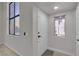 Bright foyer featuring a white front door and a window offering natural light at 2461 Old Forge Ln # 103, Las Vegas, NV 89121
