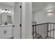 View of a stairway and a bathroom with white vanity at 2461 Old Forge Ln # 103, Las Vegas, NV 89121