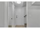 Hallway features light wood flooring and leads to white doors at 2461 Old Forge Ln # 103, Las Vegas, NV 89121