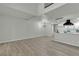 Open-concept living space with a fireplace, high ceilings, and modern finishes at 2461 Old Forge Ln # 103, Las Vegas, NV 89121