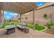 Backyard patio with modern seating, a putting green, and manicured landscaping for outdoor enjoyment at 2654 Summit Springs St, Henderson, NV 89044