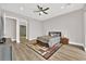 Bedroom featuring a ceiling fan, neutral decor, and an en suite bathroom at 2654 Summit Springs St, Henderson, NV 89044