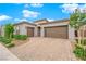 Charming home featuring a spacious three-car garage and neatly landscaped front yard at 2654 Summit Springs St, Henderson, NV 89044