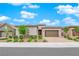 Beautiful home exterior with a well-manicured lawn, complemented by an attached garage at 2654 Summit Springs St, Henderson, NV 89044