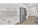 Bright kitchen area with stainless steel refrigerator and ample white cabinet space at 2654 Summit Springs St, Henderson, NV 89044