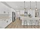 Bright kitchen featuring an island with bar stool seating and modern stainless steel appliances at 2654 Summit Springs St, Henderson, NV 89044