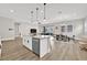 Bright open floorplan features a kitchen with an island, stainless steel appliances and dining area at 2654 Summit Springs St, Henderson, NV 89044