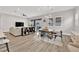 Open concept living space featuring a dining area, living room with a sofa and a backyard view at 2654 Summit Springs St, Henderson, NV 89044