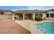 The backyard oasis boasts a pool, spa, and covered patio, for ideal outdoor relaxation at 2939 Crown Bluffs Ct, Las Vegas, NV 89117