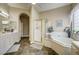 Bathroom featuring a tub, shower, vanity, and neutral color palette at 2939 Crown Bluffs Ct, Las Vegas, NV 89117
