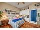 Bedroom featuring hardwood floors, a ceiling fan, built-in shelving, and an abundance of decor at 2939 Crown Bluffs Ct, Las Vegas, NV 89117