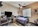 Cozy bedroom with a workspace and neutral decor at 2939 Crown Bluffs Ct, Las Vegas, NV 89117