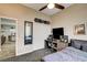 This room is furnished with a desk and a snowboard on the wall at 2939 Crown Bluffs Ct, Las Vegas, NV 89117