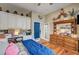 Bedroom featuring hardwood floors, a ceiling fan, built-in shelving, and an abundance of decor at 2939 Crown Bluffs Ct, Las Vegas, NV 89117