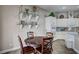 Cozy breakfast nook features a dark wood table set and decorative glass shelves at 2939 Crown Bluffs Ct, Las Vegas, NV 89117