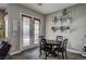 Dining area with a round table and chairs, with access to the backyard patio at 2939 Crown Bluffs Ct, Las Vegas, NV 89117